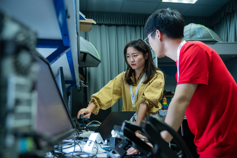 two students taking a 5g training course in a lab